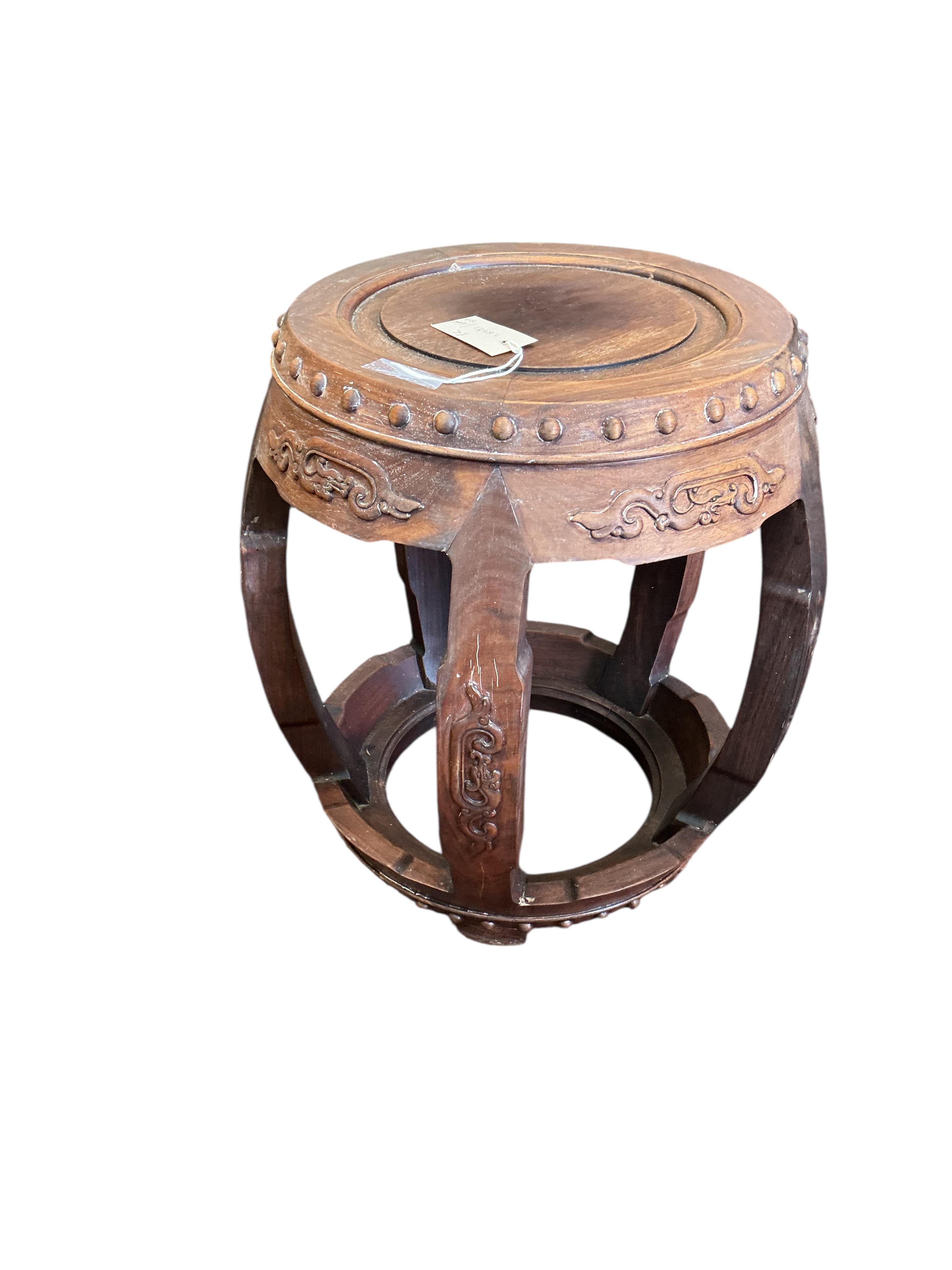 A pair of Chinese circular hardwood jardiniere stands, diameter 42cm, height 46cm